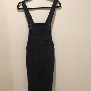 Free People black denim overalls.